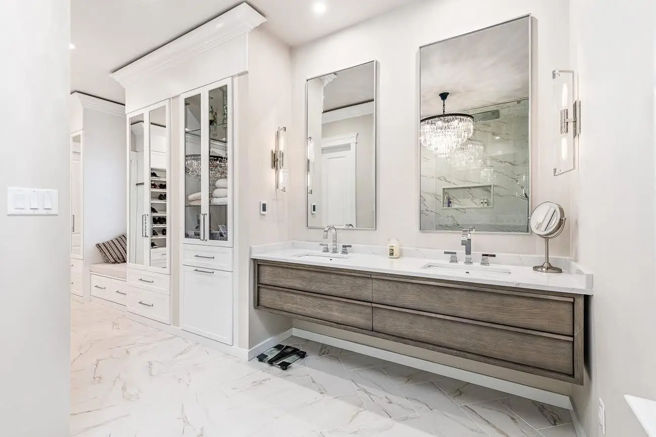 Primary bath with floating oak double vanity and marble tile — Harlan Custom Contracting project