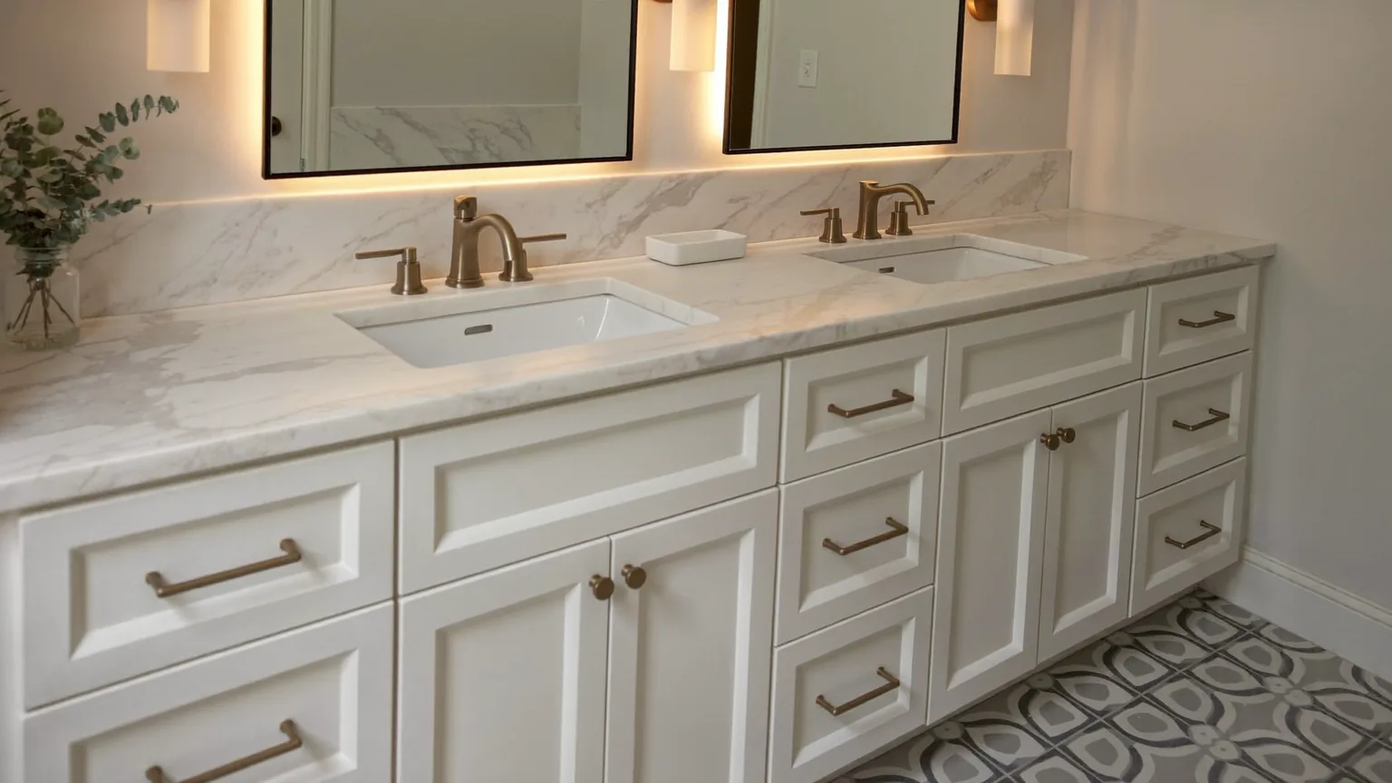 Bathroom vanity with drawers, mirror lighting and patterned floor tile